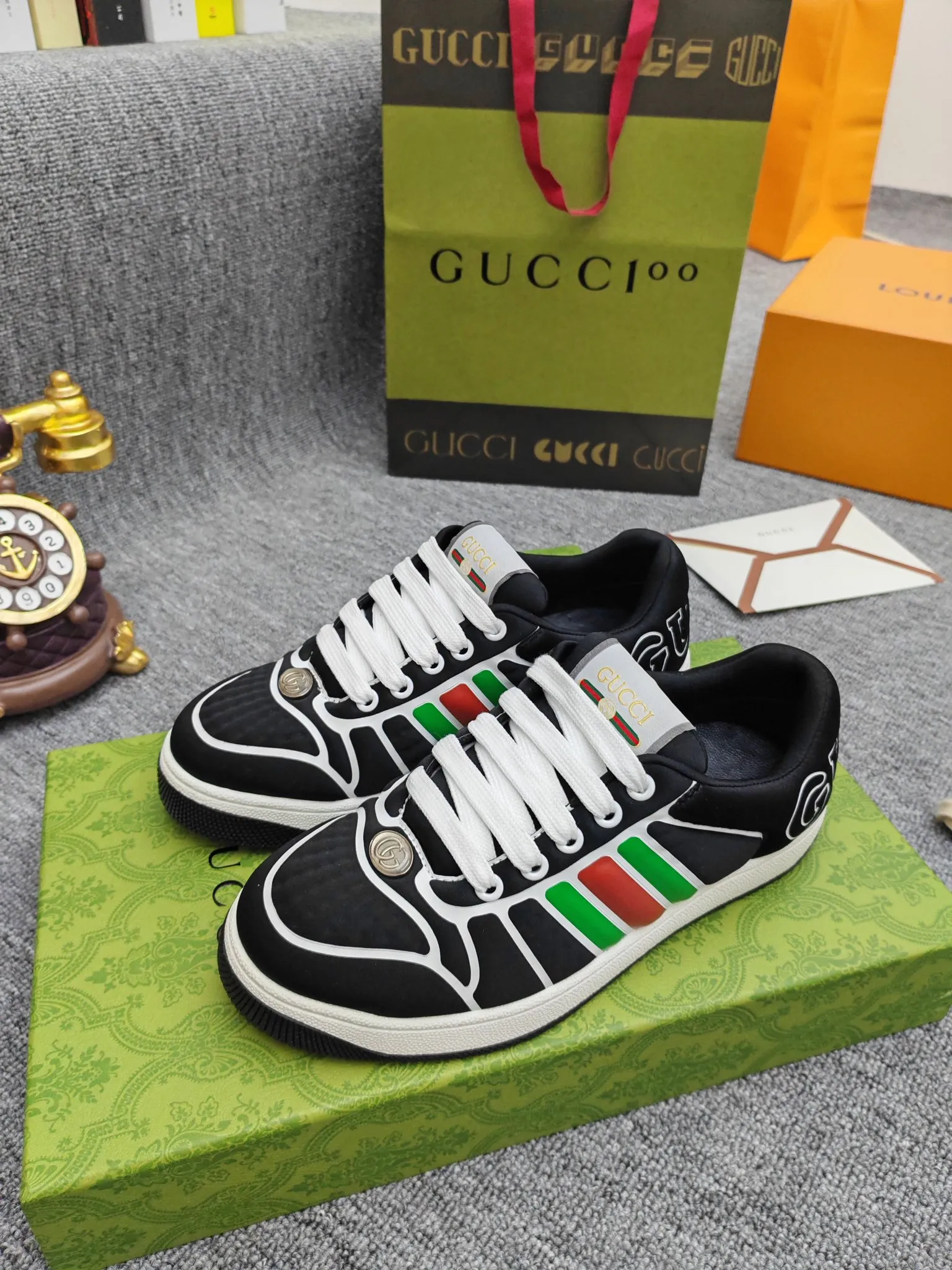 Factory price 600💰Screener series embellished web sneakers. This item is from the Gucci Lido series. Its design is inspired by the summer style and beach clubs of the Italian coast. The Screener series of sneakers draws inspiration from classic sneakers from the 1970s and takes its name from a special defensive move in sports. This shoe from the 2024 Pre-Fall collection is crafted from yellow rubber, a technical and malleable opaque material, with striped webbing on the sides and an embossed Gucci printed logo on the heel. Yellow rubber, opaque and technological in appearance. Red and green webbing decorated with metal Double G oval enamel details. Gucci printed embossed logo. Women 35-40, men 38-45, (men 38 and 45 need to be customized)